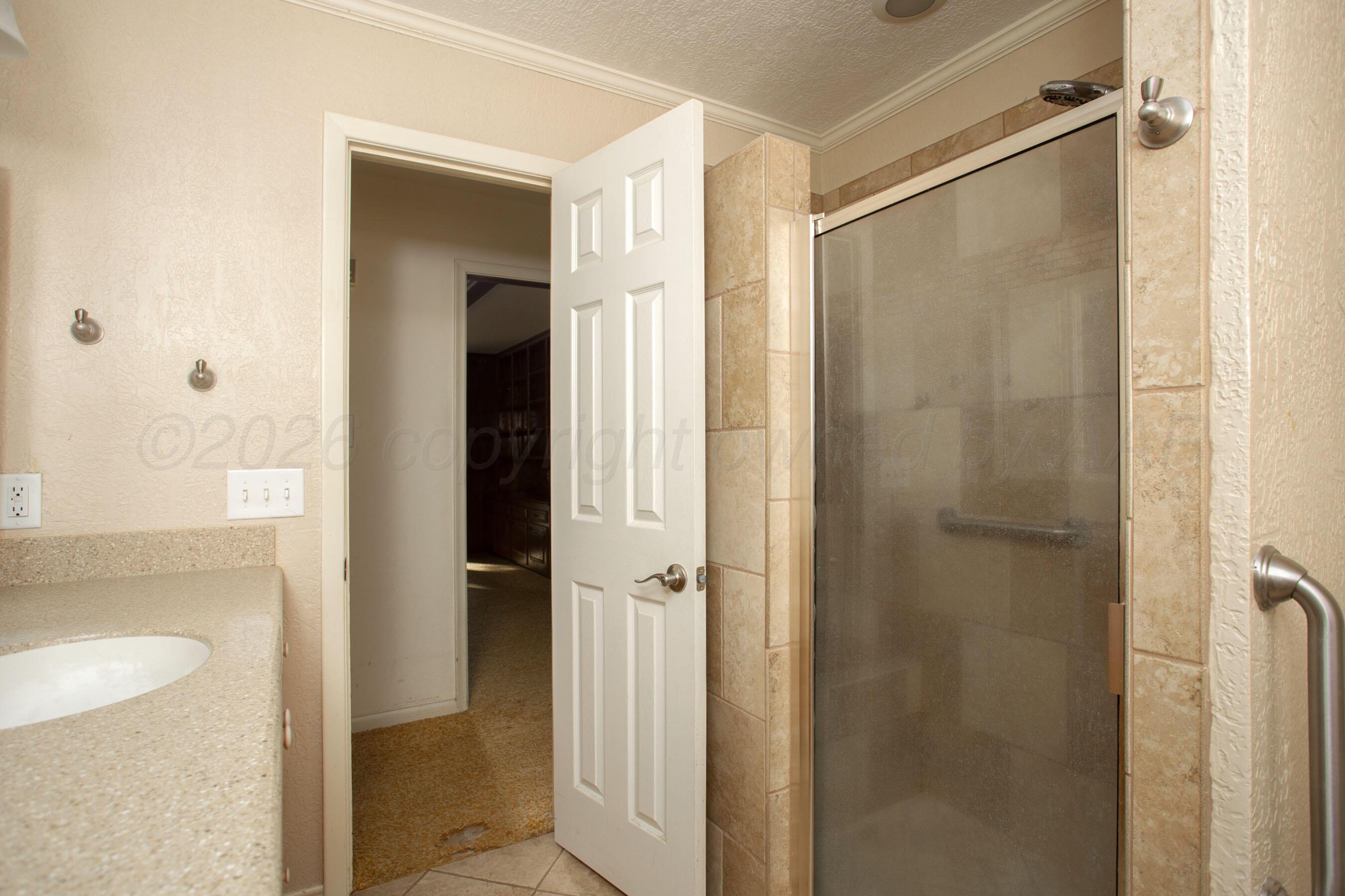 116 Dewey Avenue Amarillo, TX 79124 - Photo 13 of 35 a bathroom with a shower and a sink