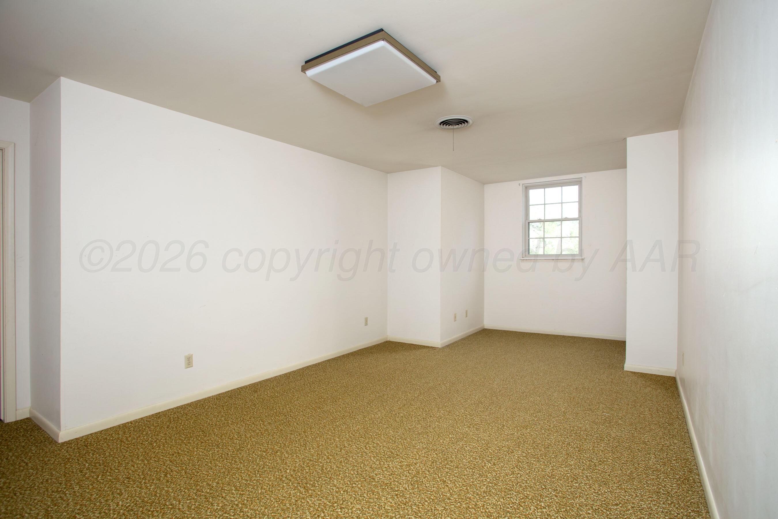116 Dewey Avenue Amarillo, TX 79124 - Photo 16 of 35 an empty room with windows and closet