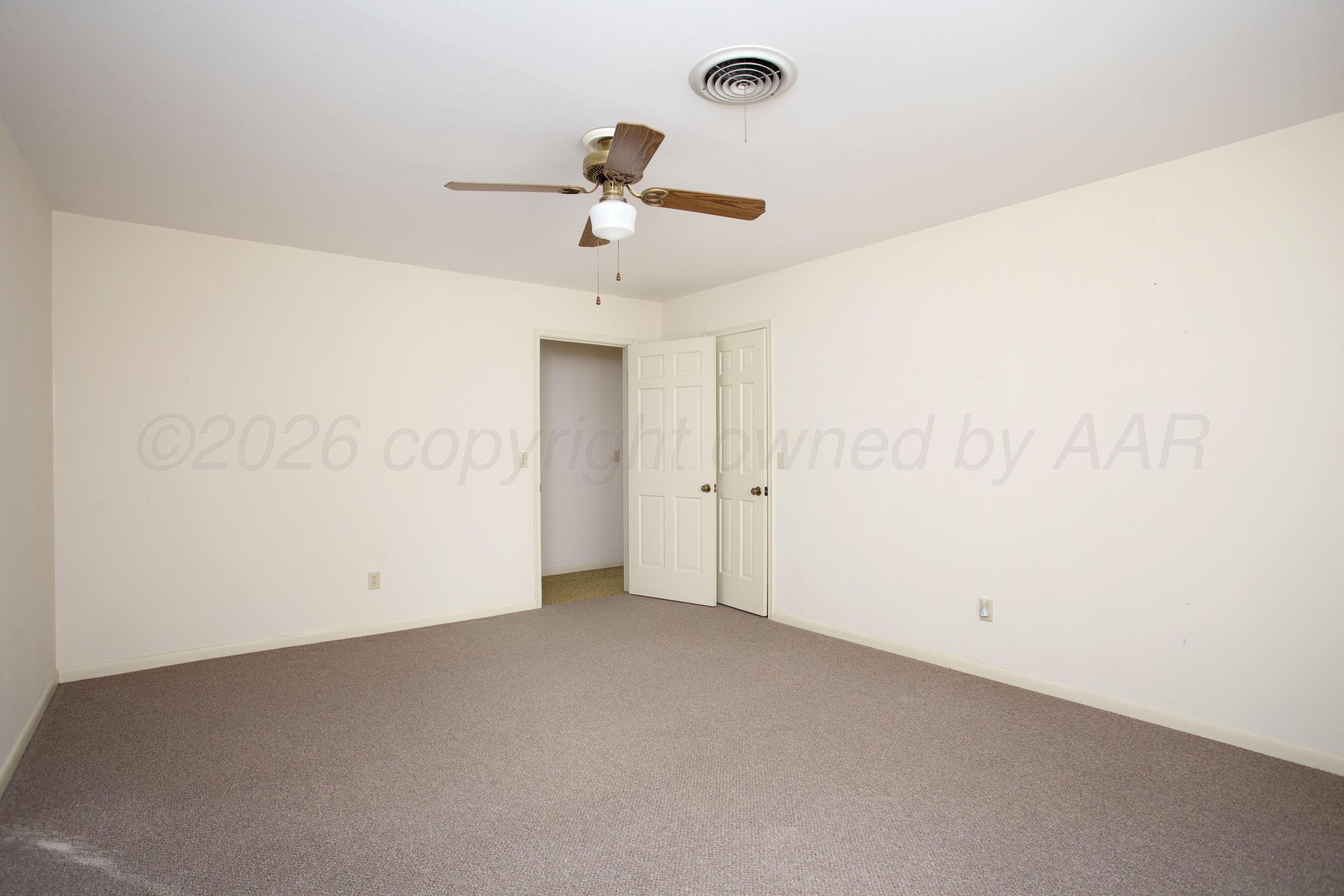 116 Dewey Avenue Amarillo, TX 79124 - Photo 22 of 35 an empty room with a empty space and a ceiling fan