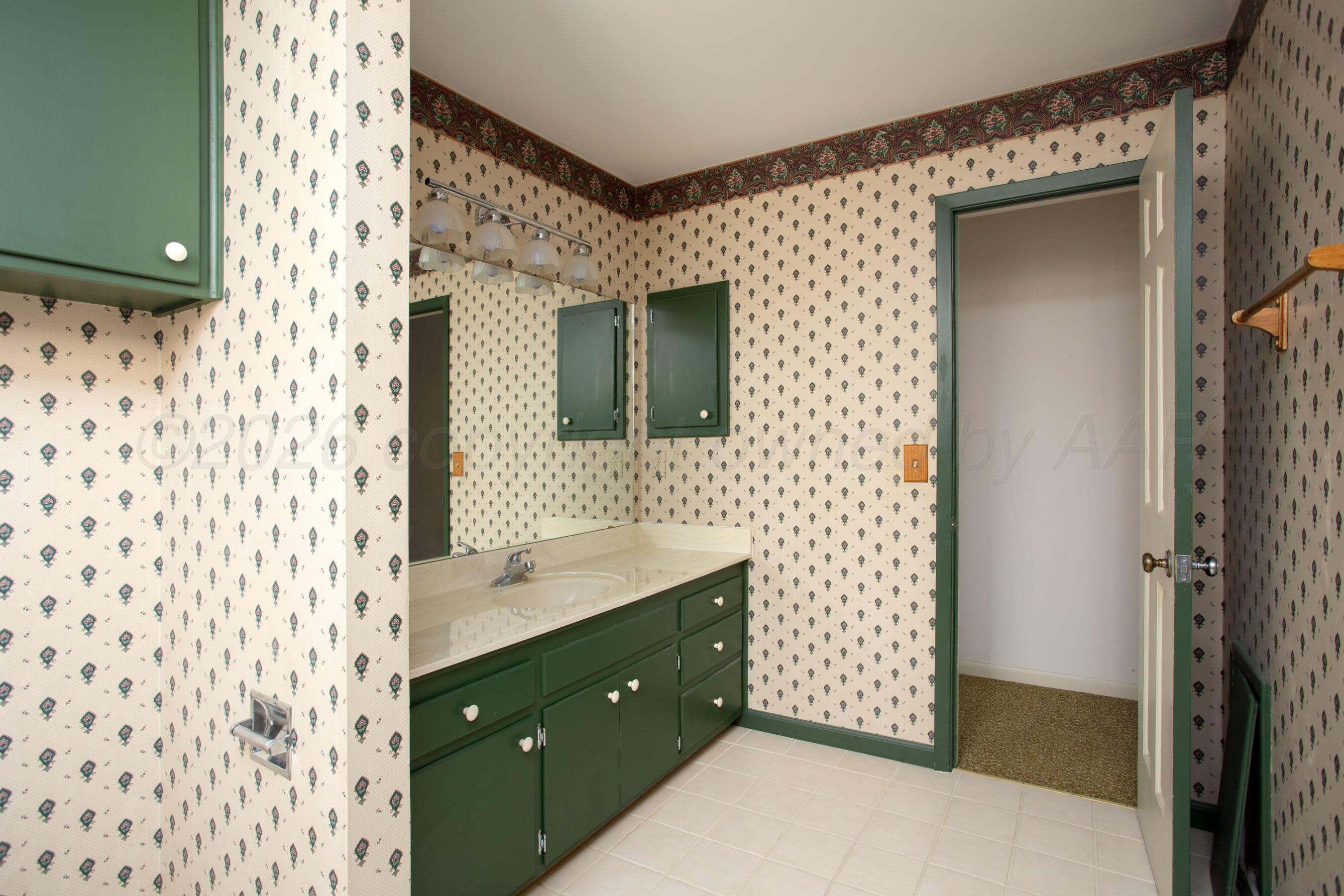 116 Dewey Avenue Amarillo, TX 79124 - Photo 23 of 35 a spacious bathroom with a double vanity sink mirror and shower