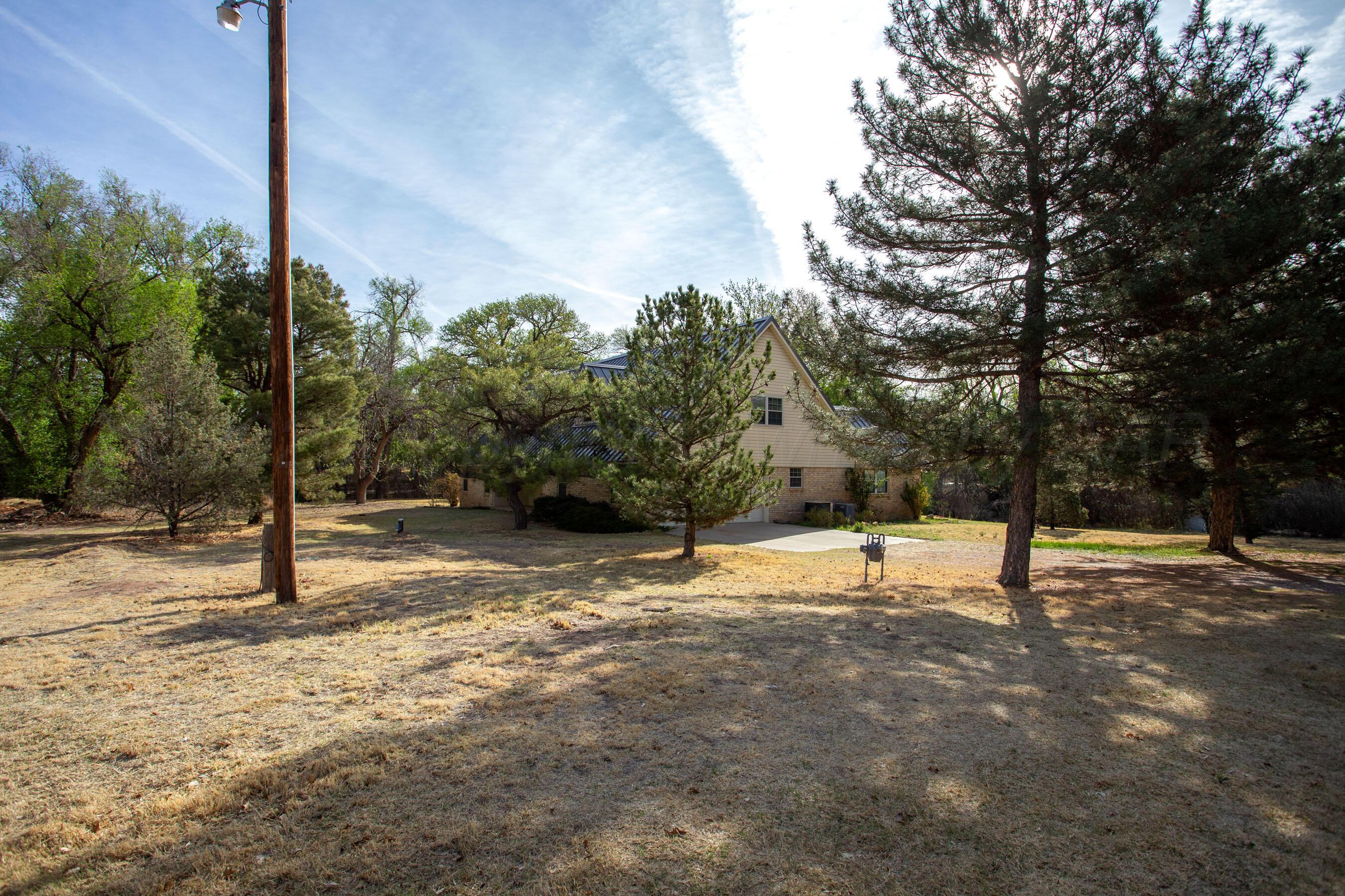 116 Dewey Avenue Amarillo, TX 79124 - Photo 34 of 35 a view of a tree with a yard