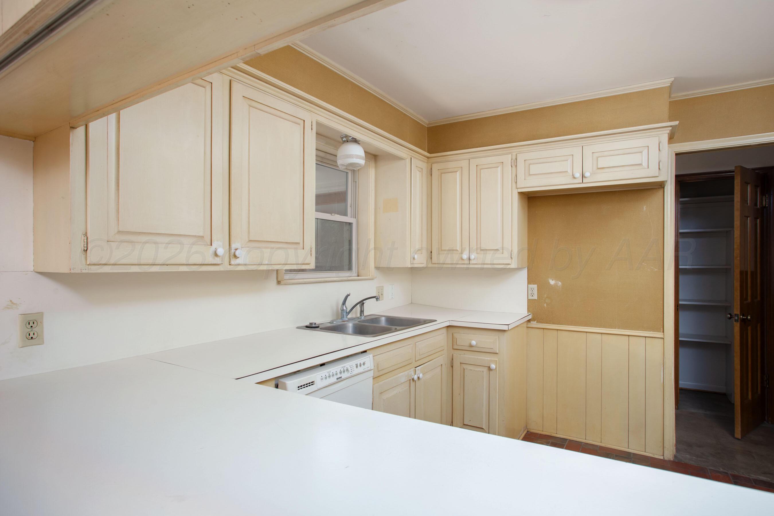 116 Dewey Avenue Amarillo, TX 79124 - Photo 6 of 35 a kitchen with stainless steel appliances granite countertop a sink and cabinets