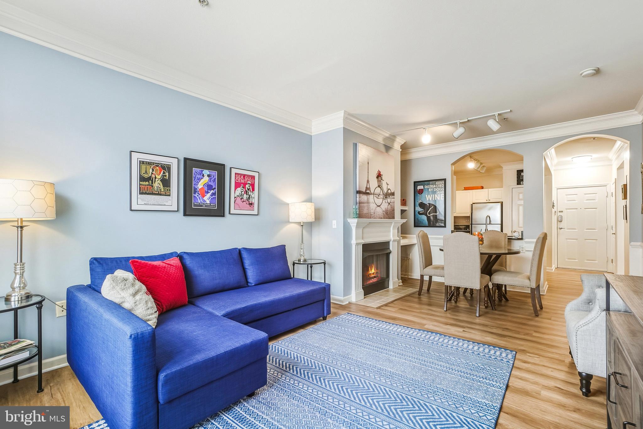 27 Booth Street, Unit 345 Gaithersburg, MD 20878 - Photo 17 of 40 a living room with furniture kitchen view and a wooden floor