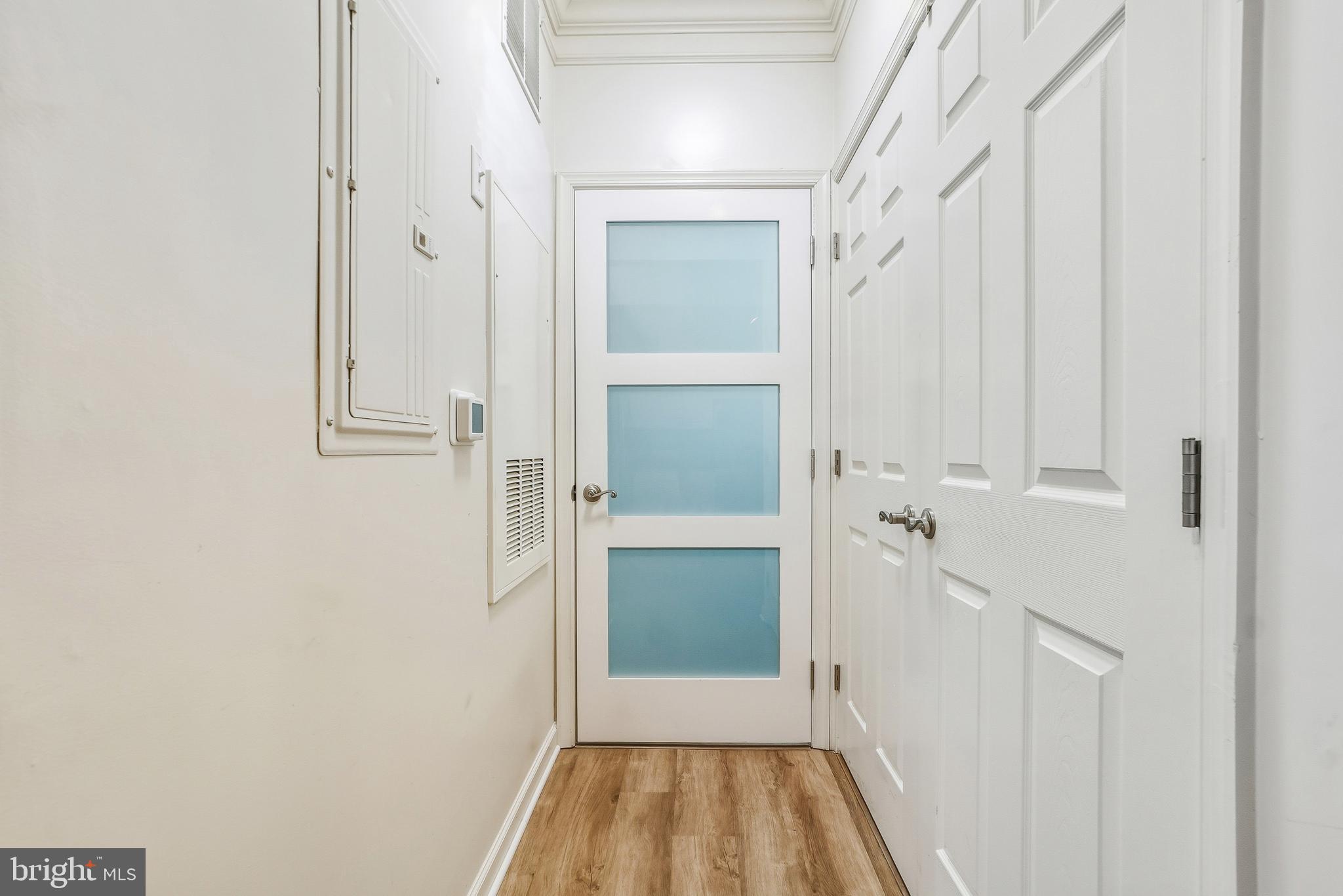 27 Booth Street, Unit 345 Gaithersburg, MD 20878 - Photo 21 of 40 a view of a hallway with wooden floor and staircase