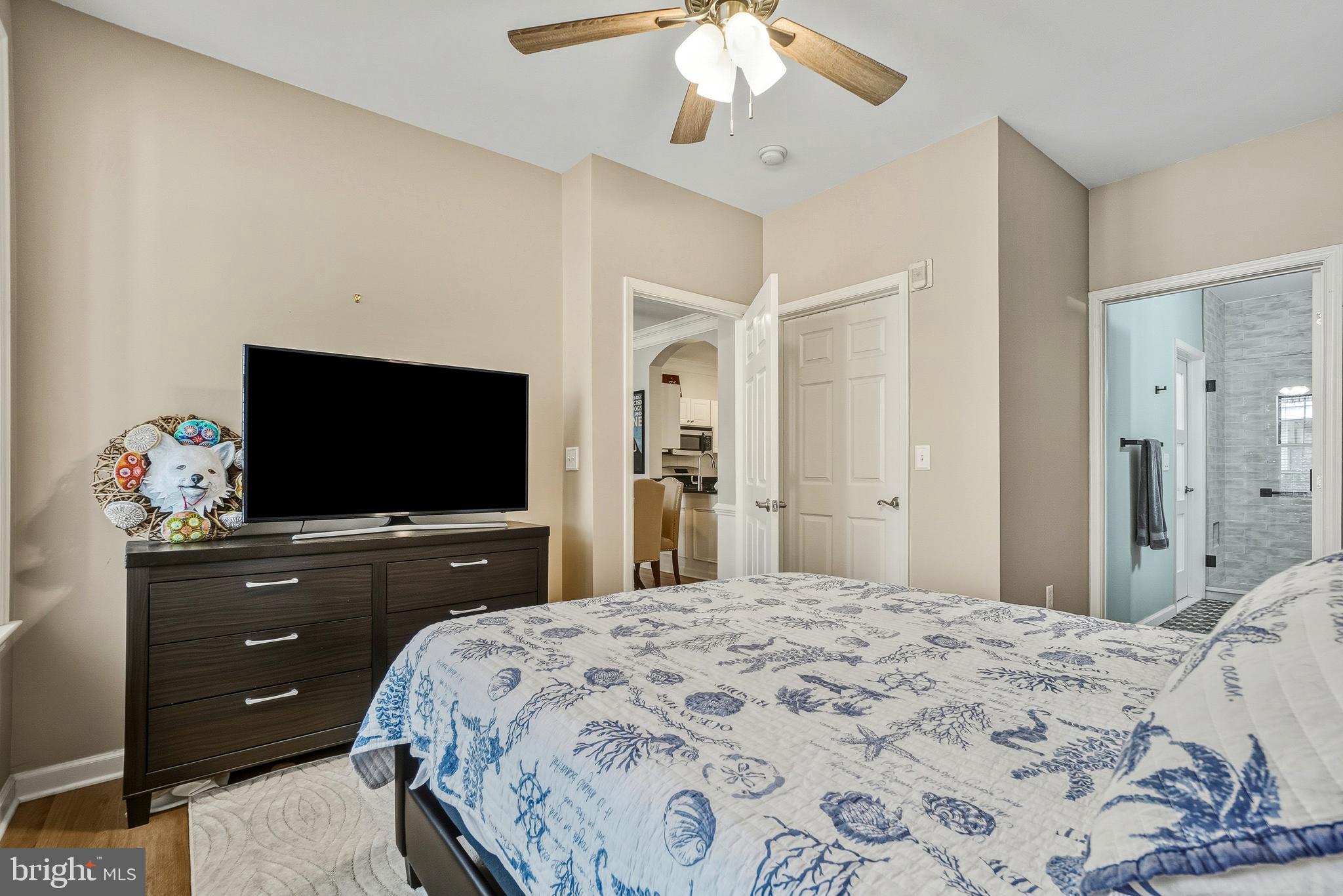 27 Booth Street, Unit 345 Gaithersburg, MD 20878 - Photo 26 of 40 a bedroom with a bed and a flat screen tv