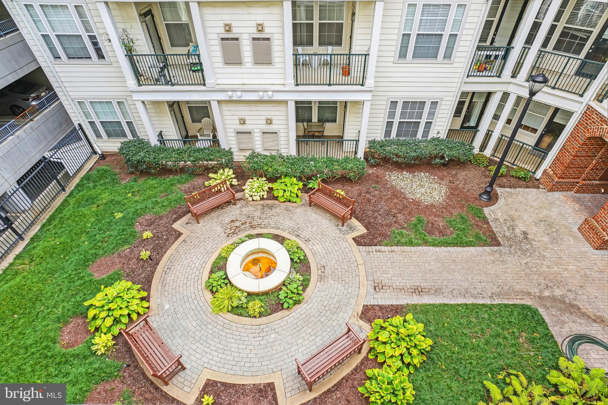 27 Booth Street, Unit 345 Gaithersburg, MD 20878 - Photo 28 of 40 a view of a house with a backyard and a garden