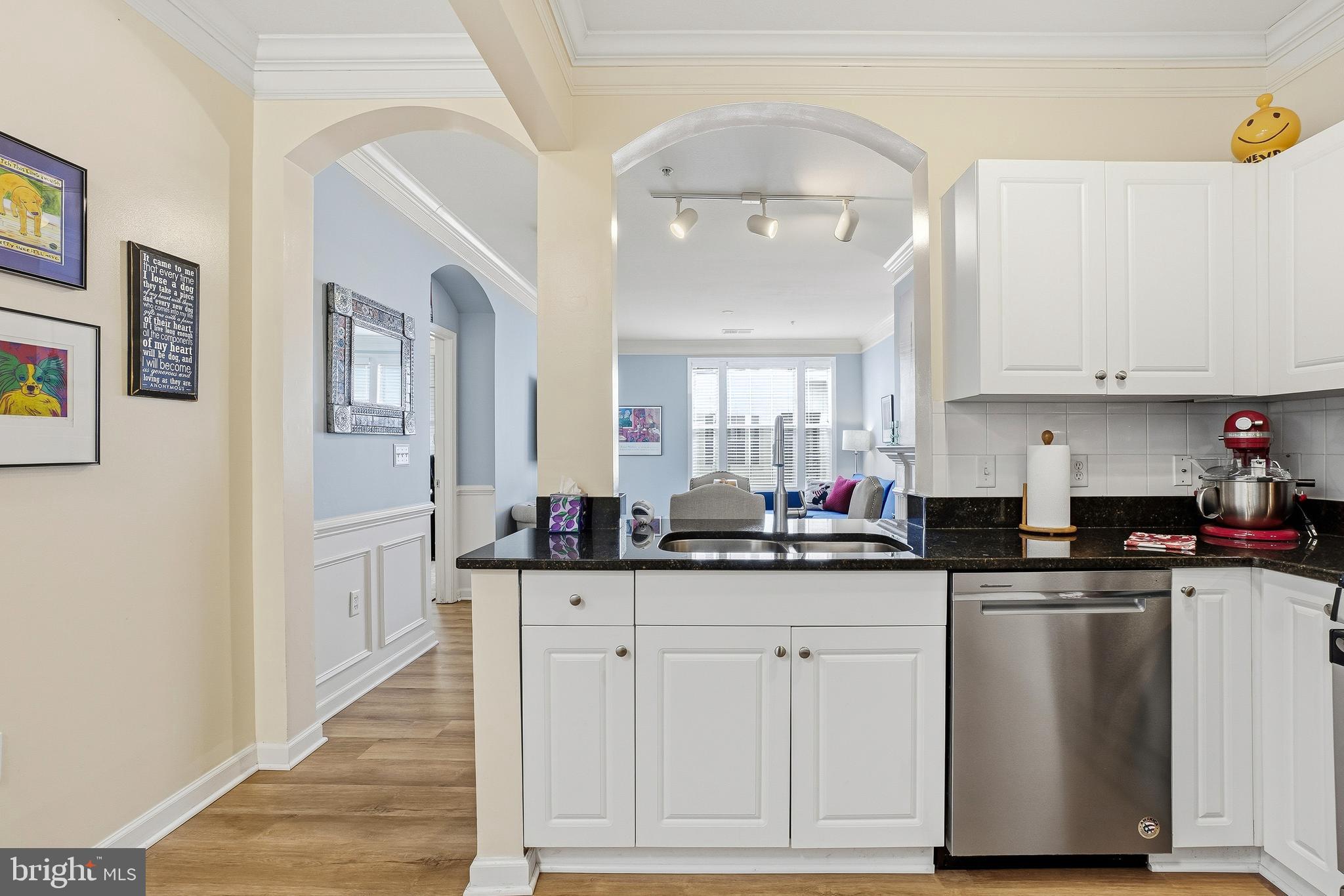 27 Booth Street, Unit 345 Gaithersburg, MD 20878 - Photo 7 of 40 a kitchen with stainless steel appliances granite countertop a sink and cabinets