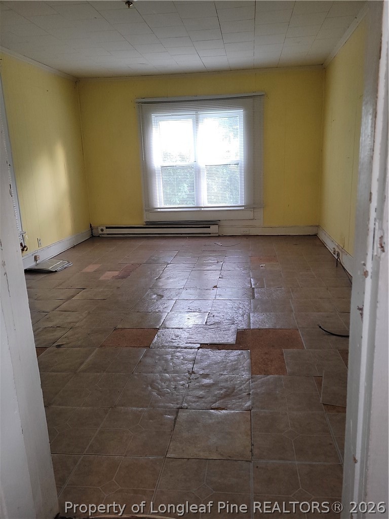 39 Durant Road Wilson's Mills, NC 27527 - Photo 9 of 11 an empty room with windows
