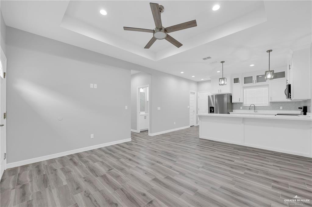 1318 San Vicente, Unit 4 Weslaco, TX 78596 - Photo 4 of 9 a view of an empty room and kitchen view
