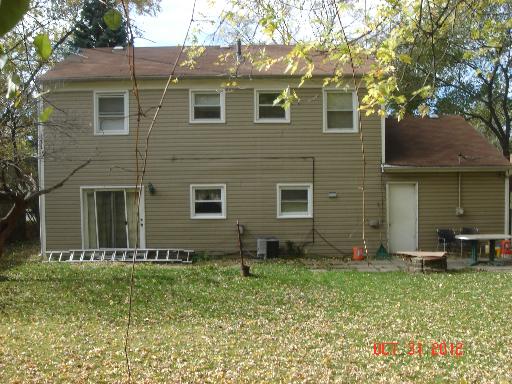 140 North Pinecrest Road Bolingbrook, IL 60440 - Photo 12 of 13 a front view of a house with garden