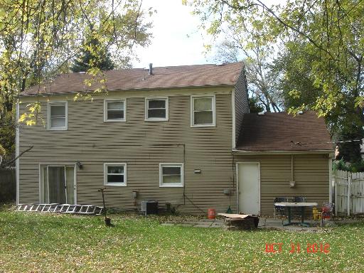 140 North Pinecrest Road Bolingbrook, IL 60440 - Photo 13 of 13 a front view of a house with a yard