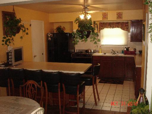140 North Pinecrest Road Bolingbrook, IL 60440 - Photo 3 of 13 a view of a dining room with furniture and a chandelier