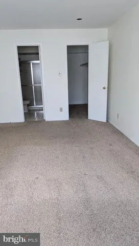 an empty room with a empty space and window