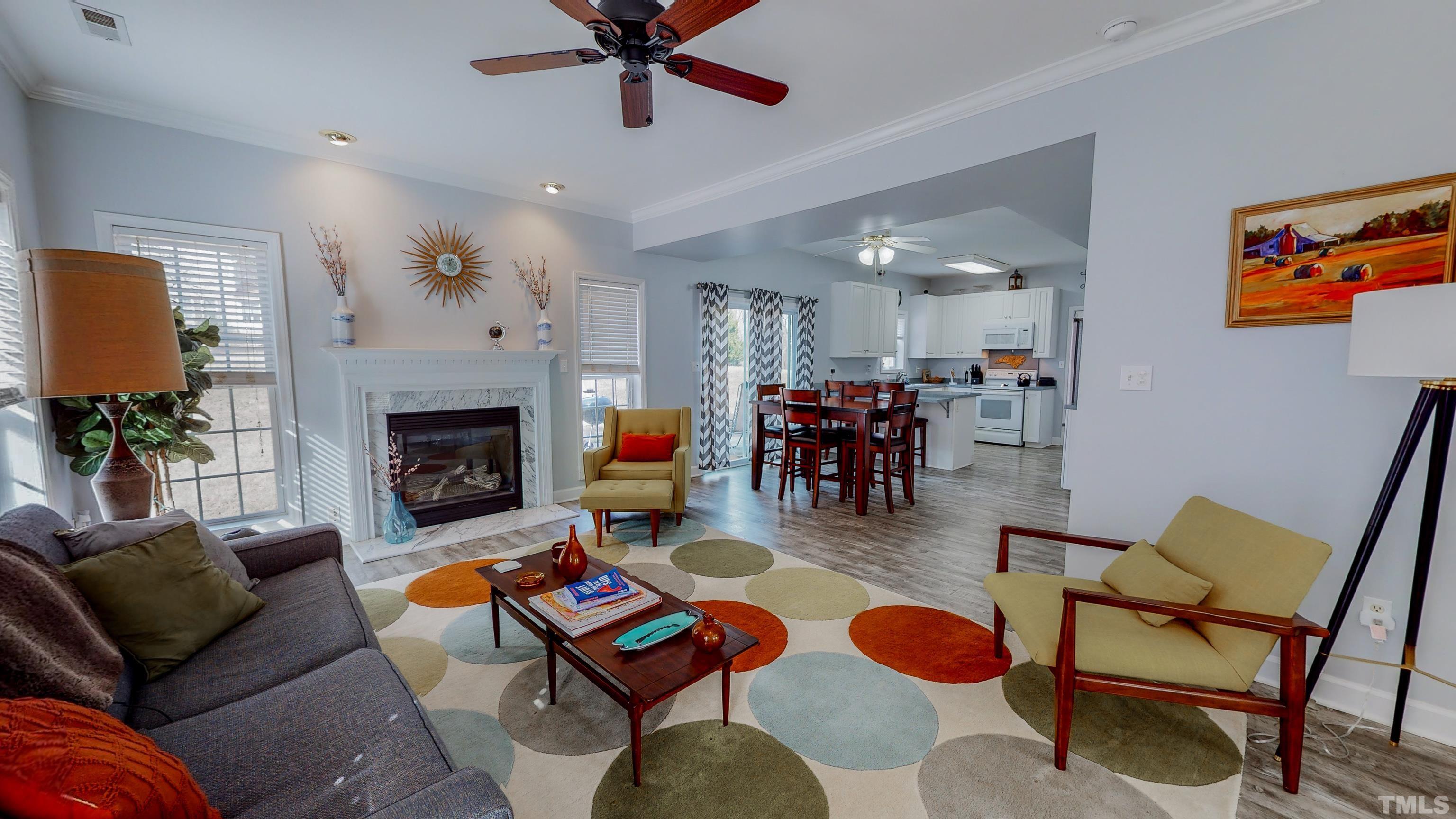 145 Deep Creek Point Rougemont, NC 27572 - Photo 14 of 52 a living room with furniture and a fireplace
