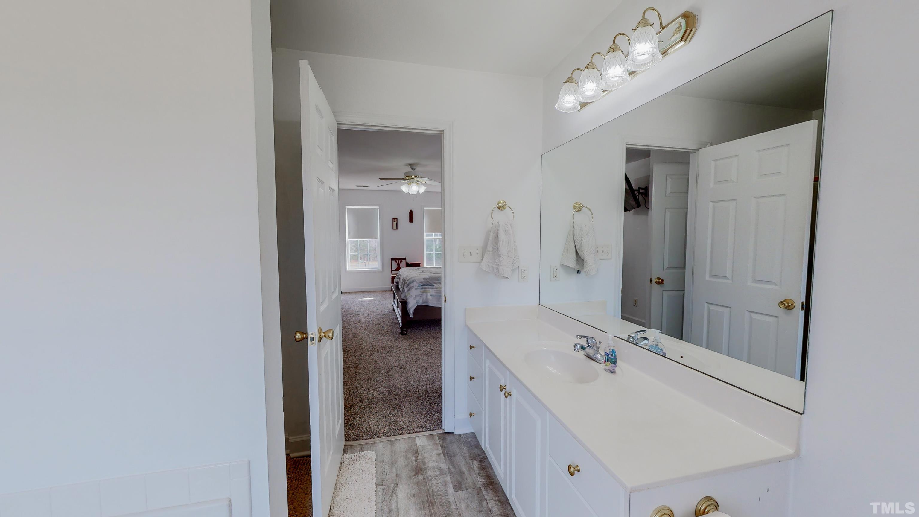 145 Deep Creek Point Rougemont, NC 27572 - Photo 20 of 52 a spacious bathroom with a double vanity sink mirror and shower