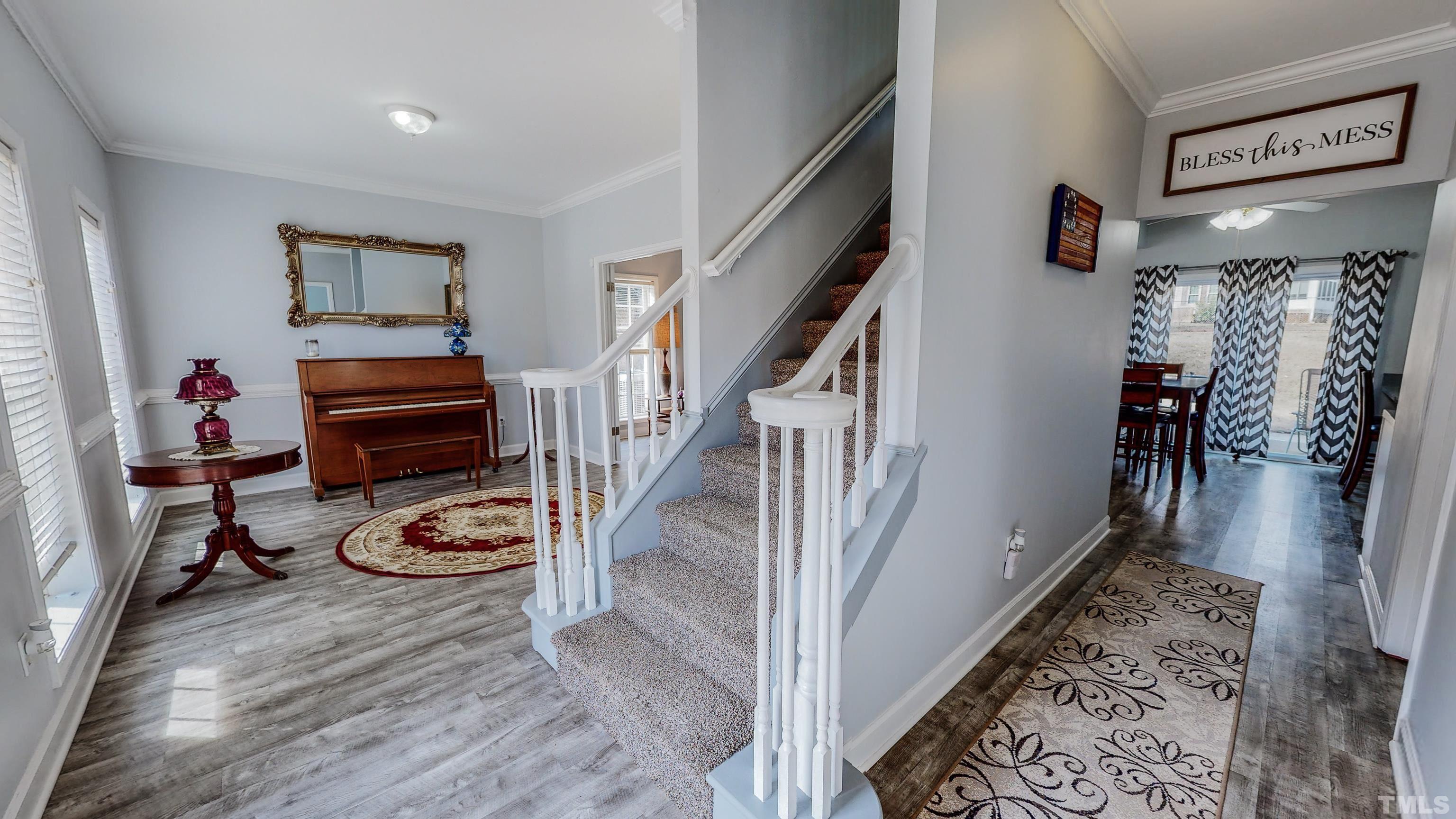 145 Deep Creek Point Rougemont, NC 27572 - Photo 24 of 52 a view of a hallway with workspace and wooden floor