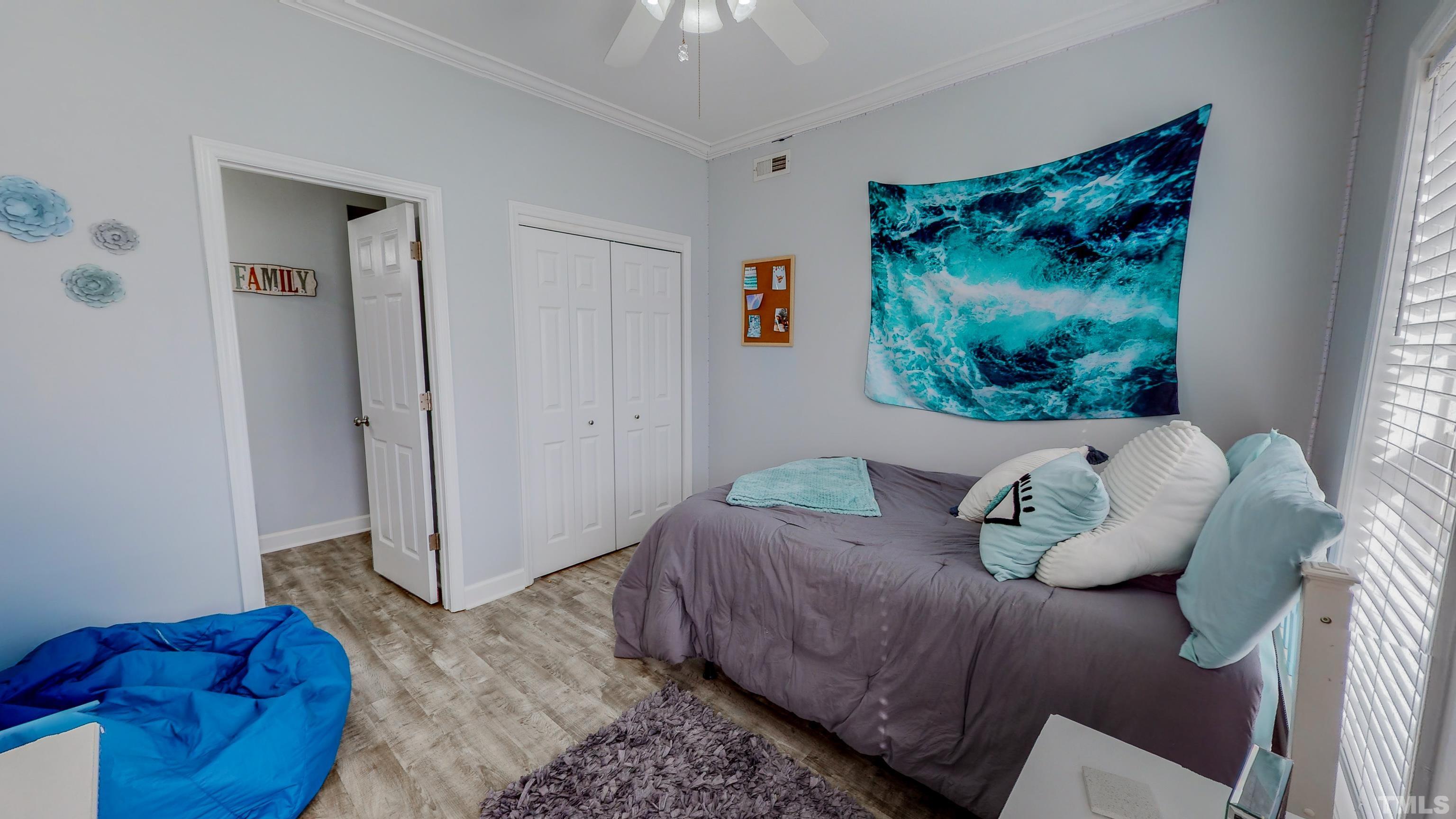 145 Deep Creek Point Rougemont, NC 27572 - Photo 26 of 52 a bed room with a bed and a painting on the wall