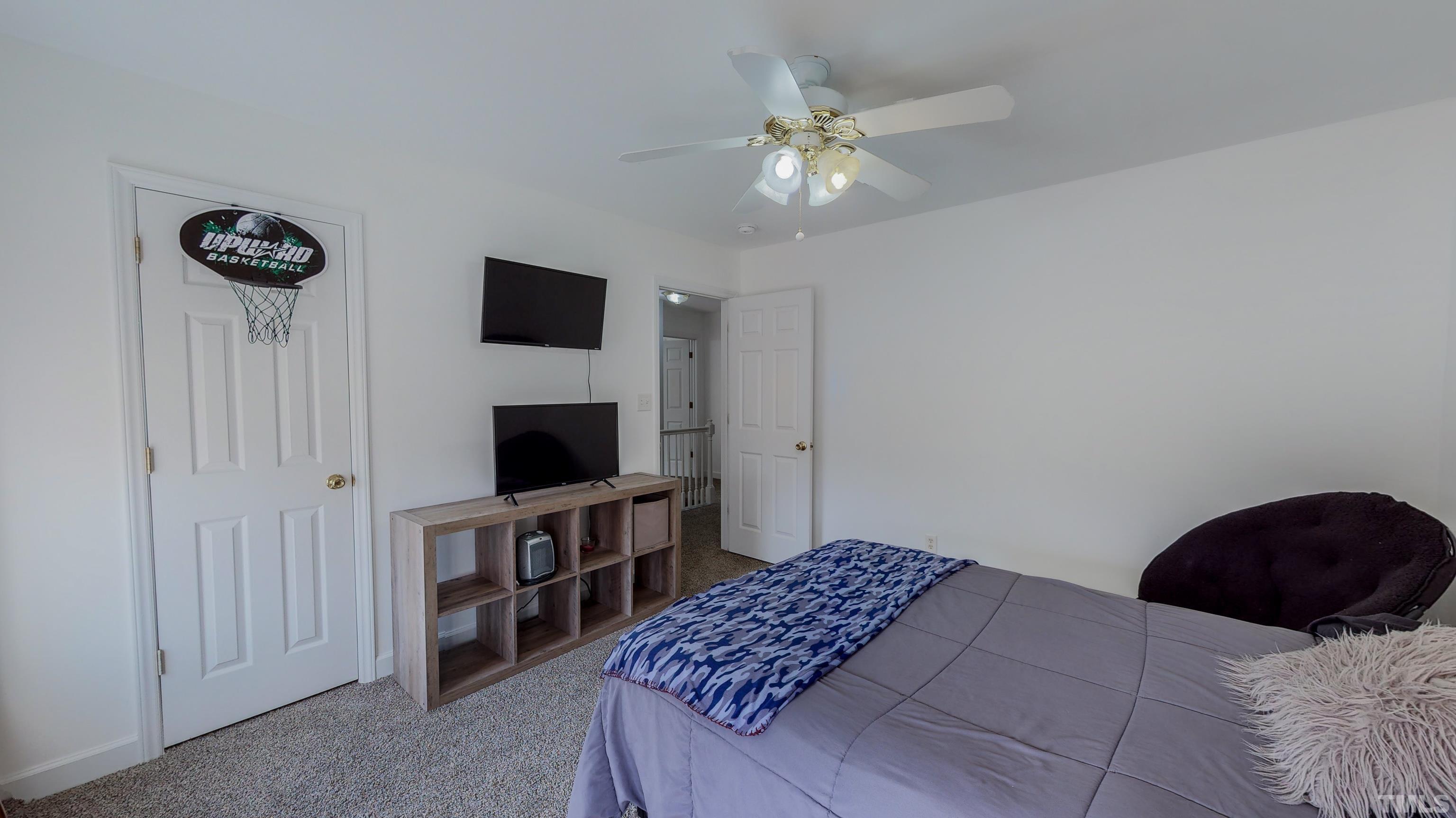 145 Deep Creek Point Rougemont, NC 27572 - Photo 32 of 52 a bedroom with a bed and a television