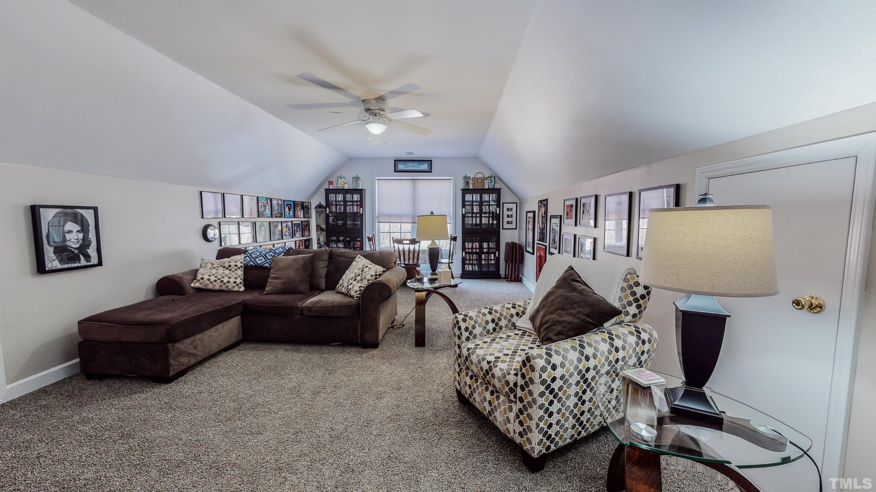 145 Deep Creek Point Rougemont, NC 27572 - Photo 34 of 52 a living room with furniture and a lamp