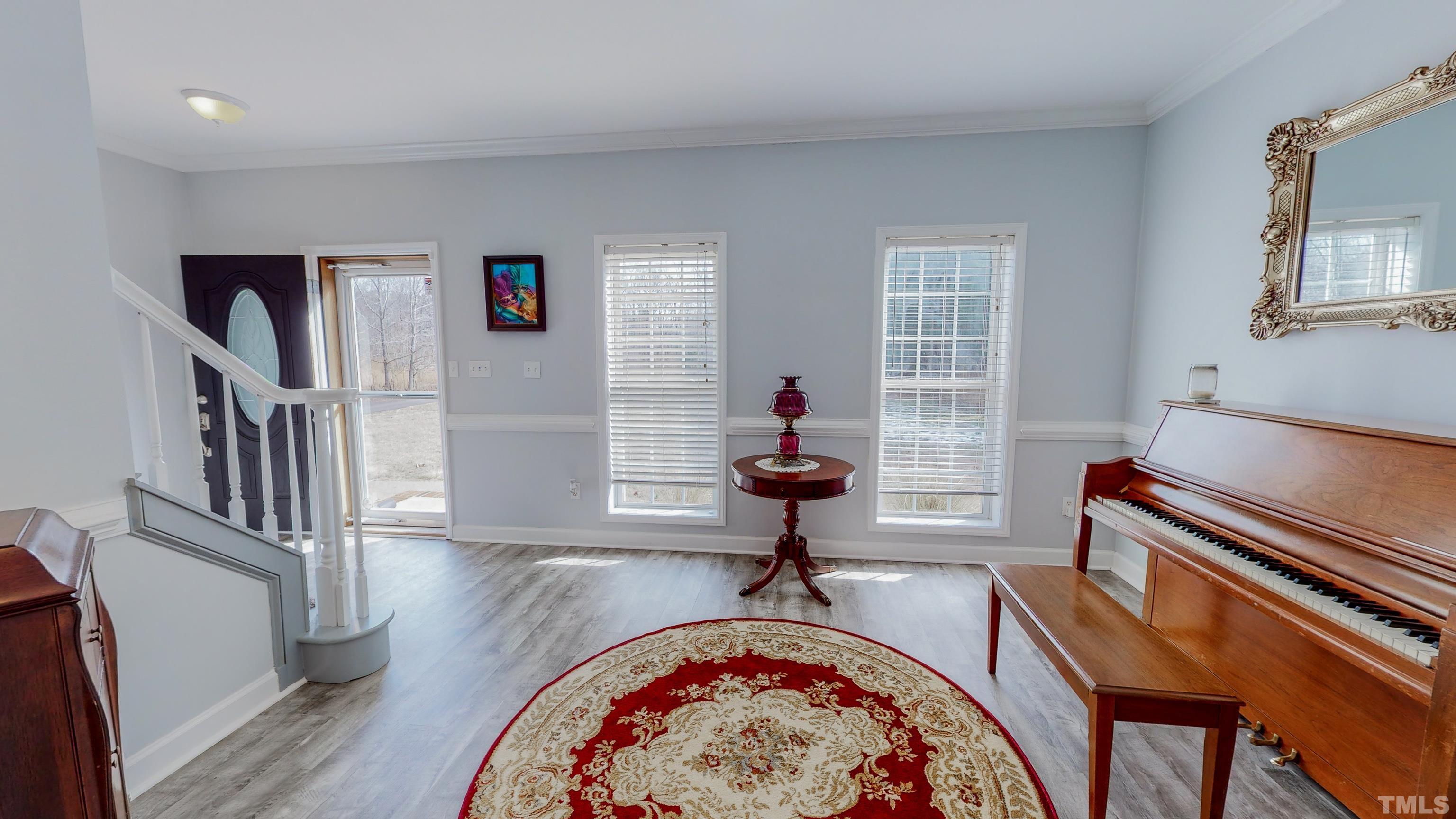 145 Deep Creek Point Rougemont, NC 27572 - Photo 43 of 52 a view of a livingroom with furniture and a staircase