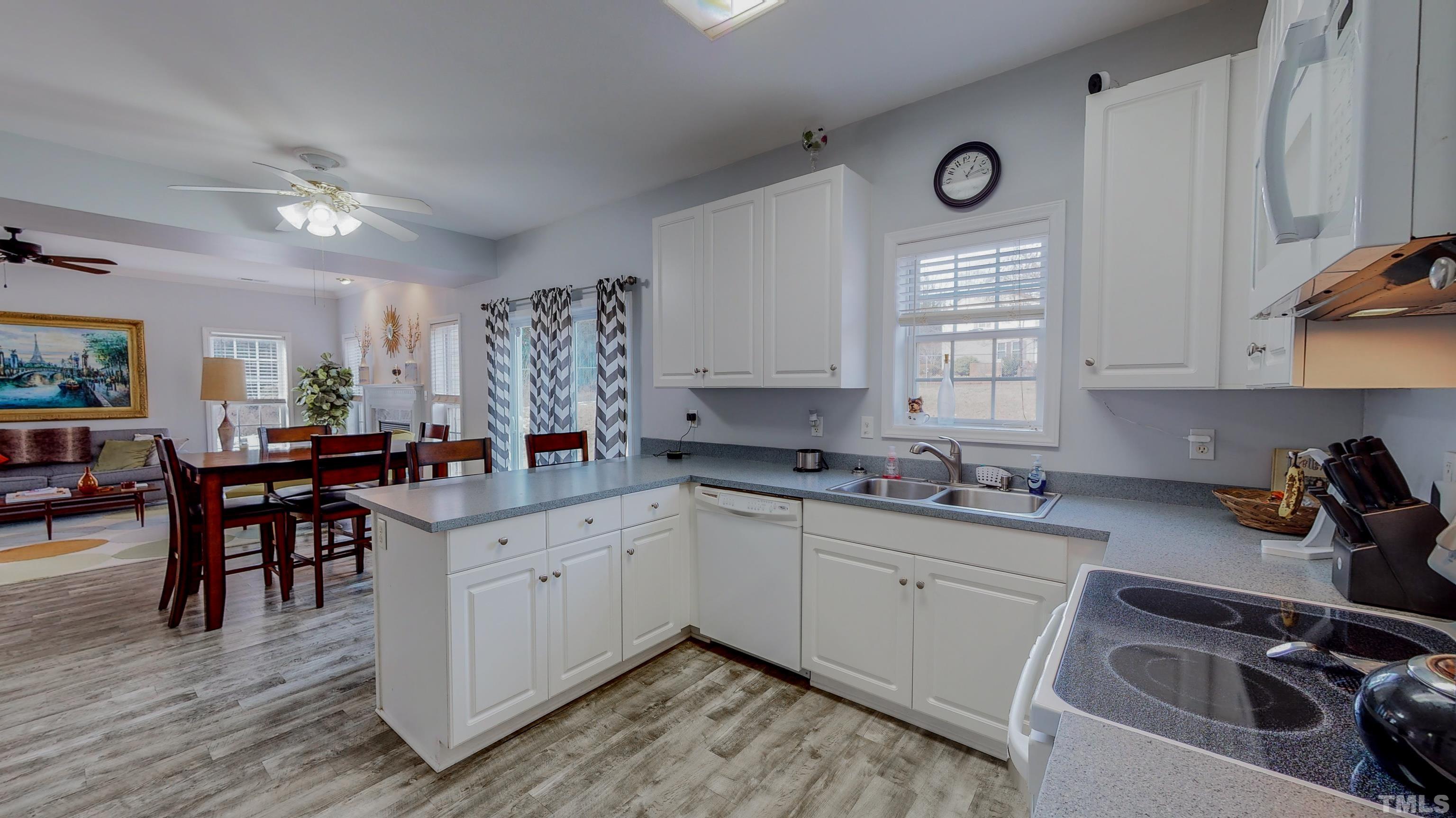 145 Deep Creek Point Rougemont, NC 27572 - Photo 6 of 52 a kitchen with a sink a window and appliances