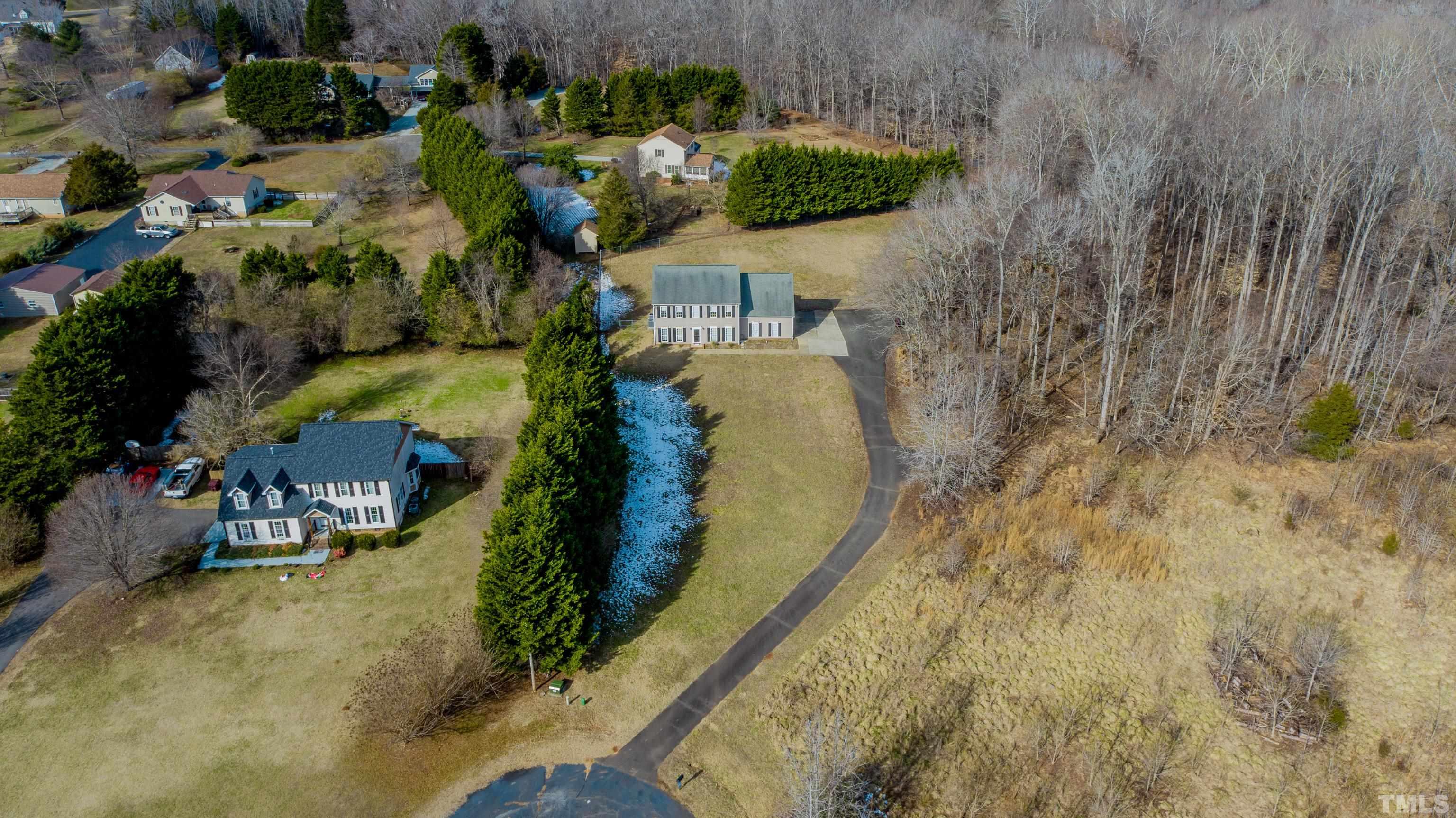 145 Deep Creek Point Rougemont, NC 27572 - Photo 10 of 52 a view of a house with a yard