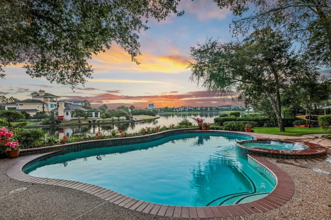 35 West Isle Place The Woodlands, TX 77381 - Photo 7 of 45 Resort-style swimming pool overlooking the water, perfect for entertaining and relaxing.