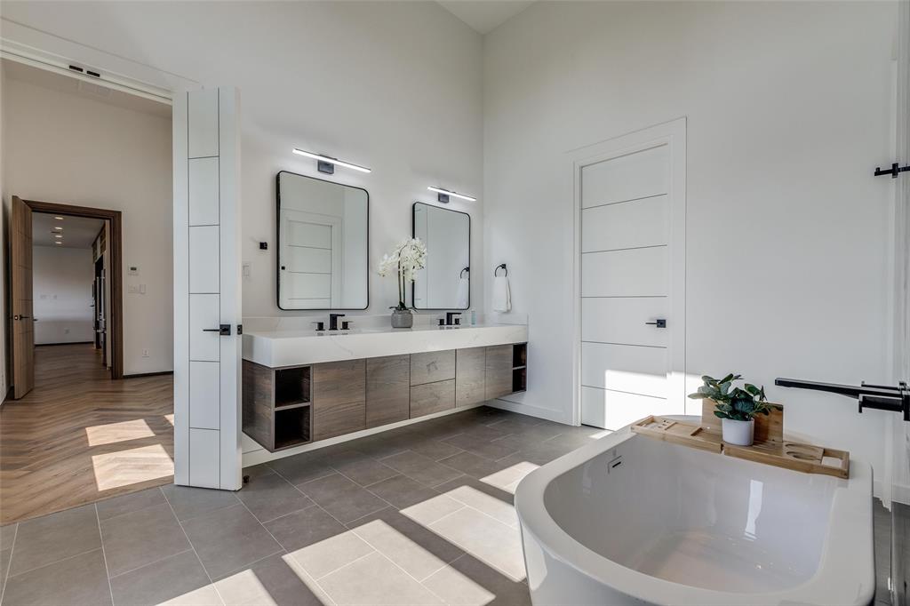 3601 Sky Rdg Lane Melissa, TX 75454 - Photo 22 of 31 a bathroom with a bathtub a double vanity sink and mirror