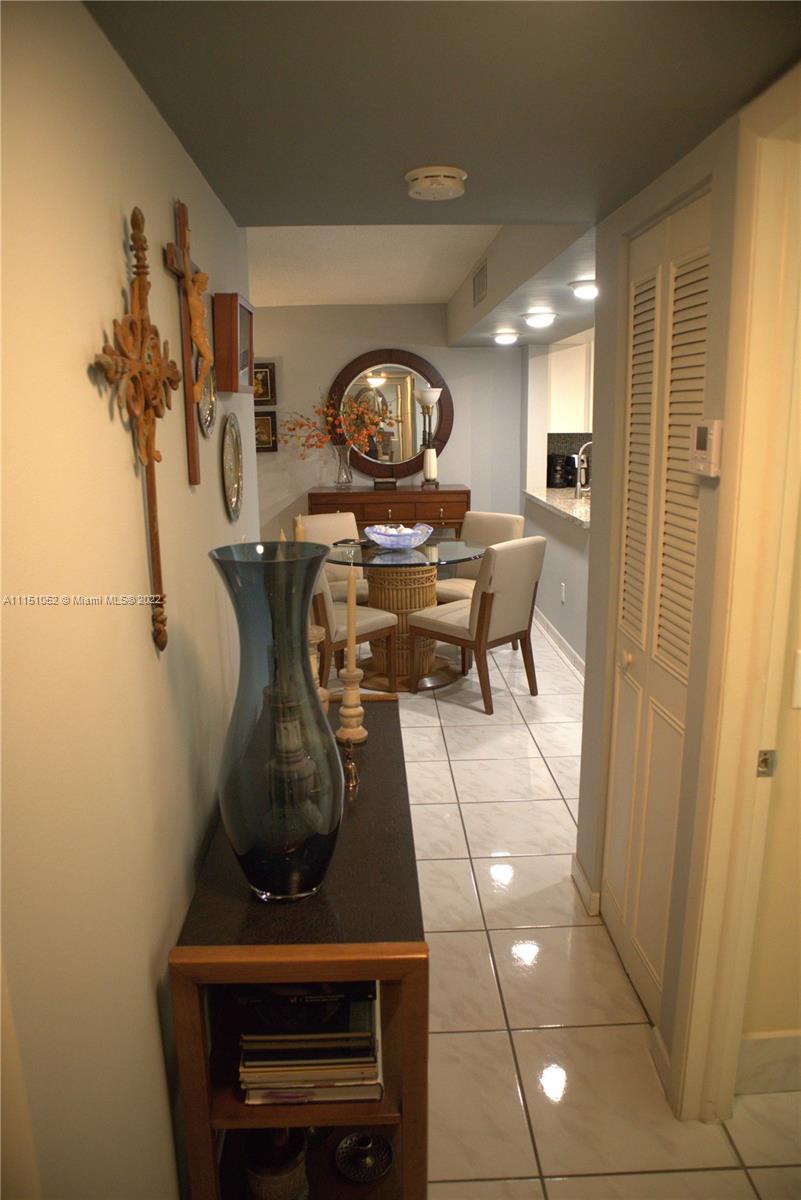 8625 Northwest 8th Street, Unit 420 Miami, FL 33126 - Photo 11 of 26 a view of dining room with furniture