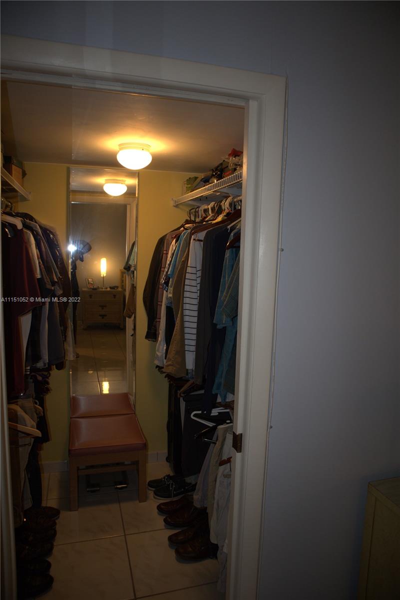 8625 Northwest 8th Street, Unit 420 Miami, FL 33126 - Photo 19 of 26 a view of walk in closet