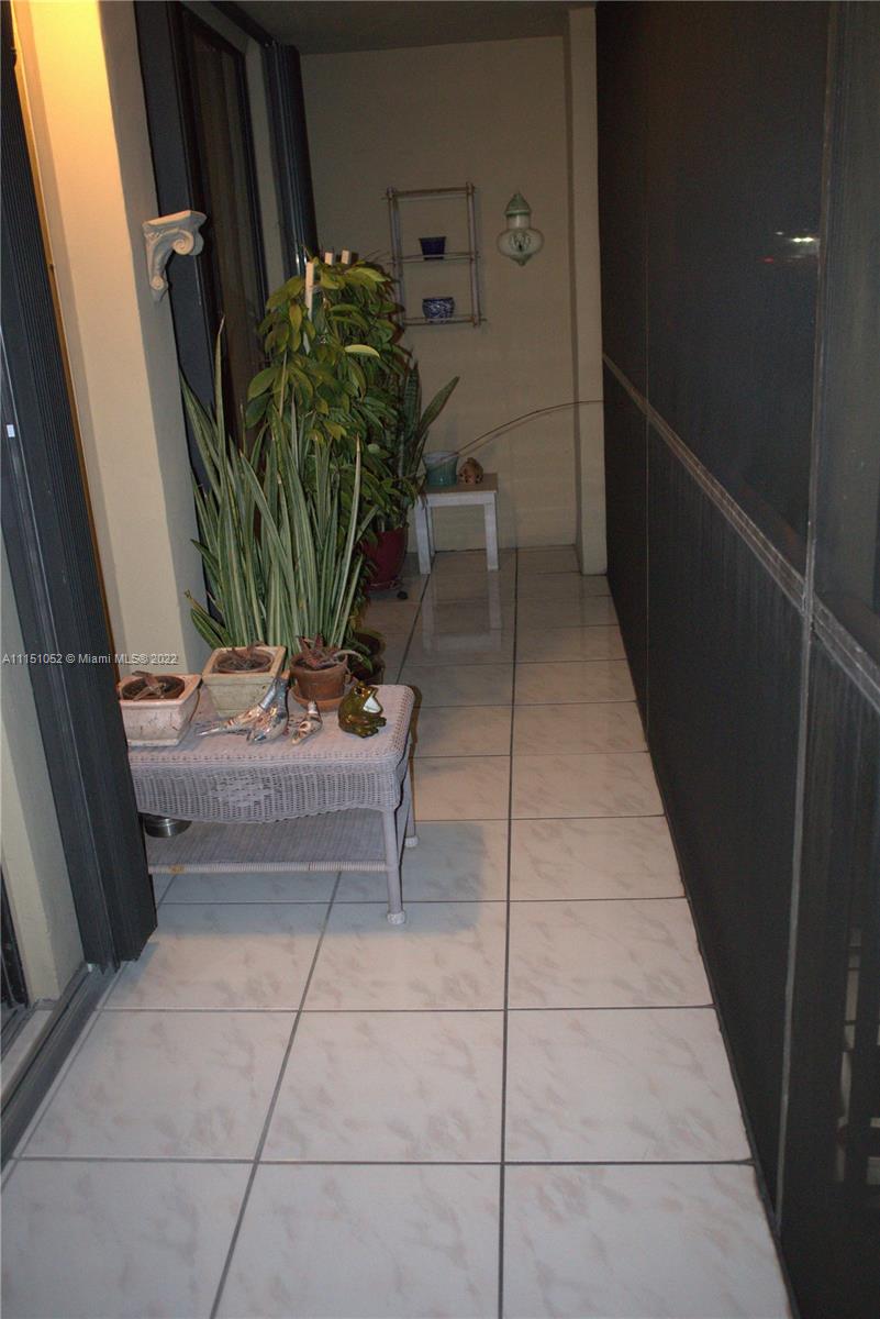 8625 Northwest 8th Street, Unit 420 Miami, FL 33126 - Photo 23 of 26 a view of balcony with furniture