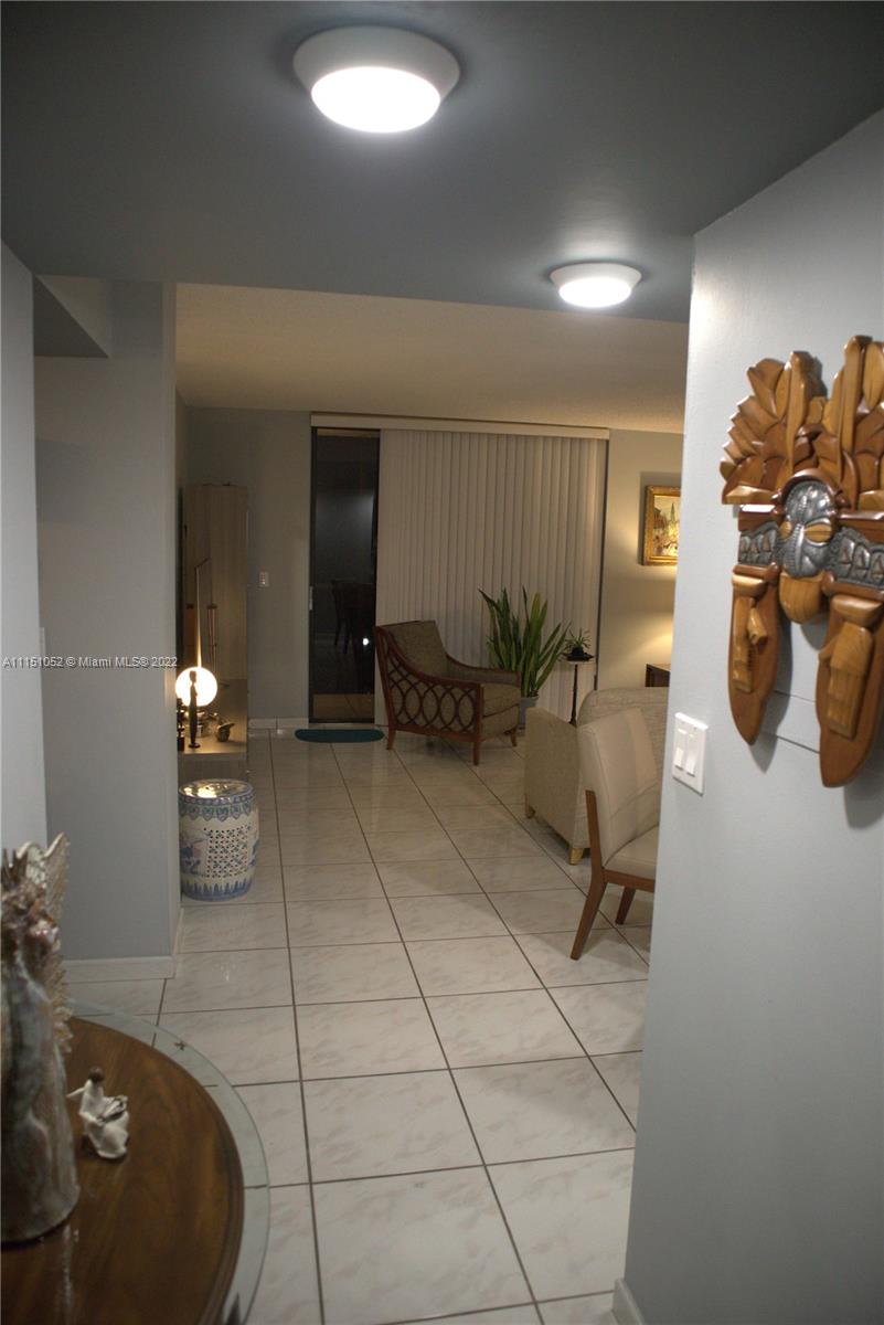 8625 Northwest 8th Street, Unit 420 Miami, FL 33126 - Photo 3 of 26 a view of a room with gym equipment