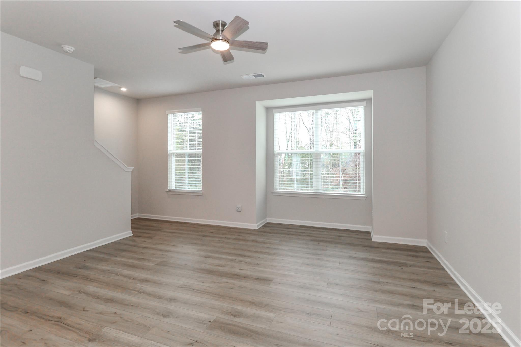 5038 Springarn Court Charlotte, NC 28208 - Photo 17 of 47 a view of an empty room with a window and wooden floor