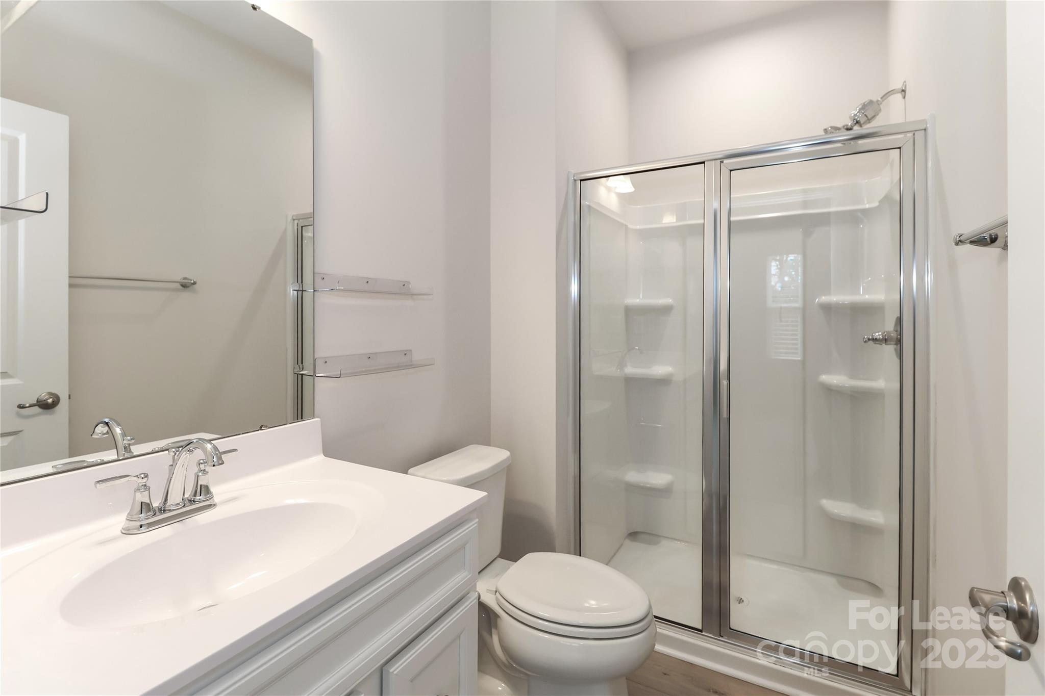 5038 Springarn Court Charlotte, NC 28208 - Photo 24 of 47 a bathroom with a sink toilet and shower