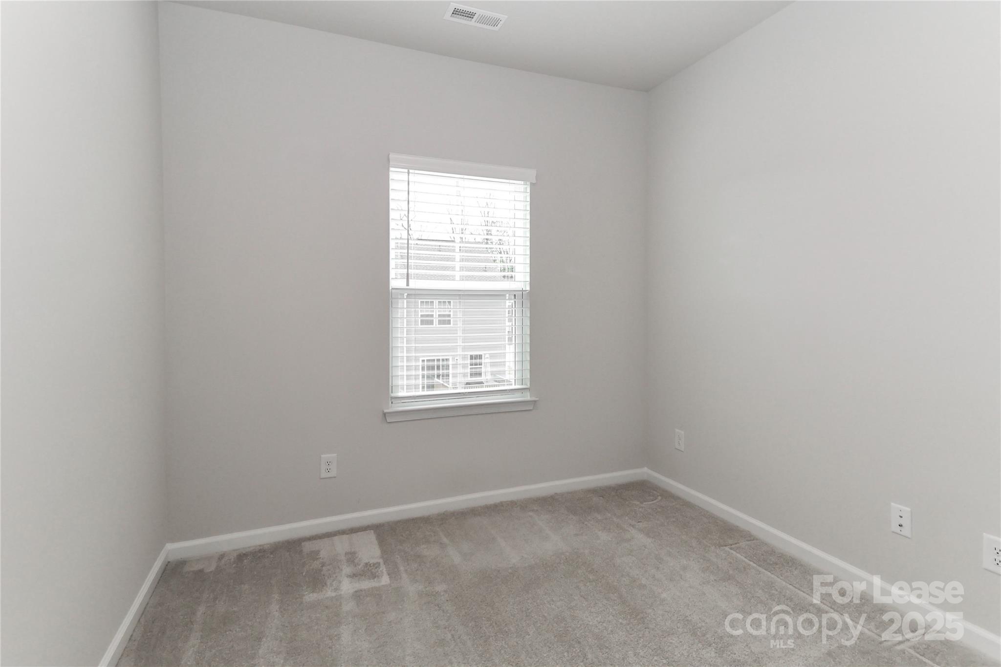 5038 Springarn Court Charlotte, NC 28208 - Photo 25 of 47 an empty room with a window