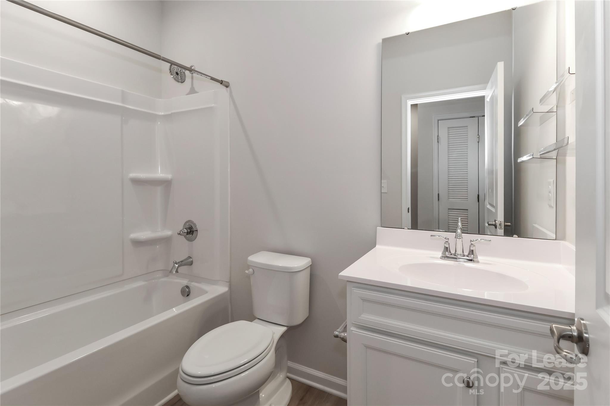 5038 Springarn Court Charlotte, NC 28208 - Photo 27 of 47 a bathroom with a sink toilet and shower