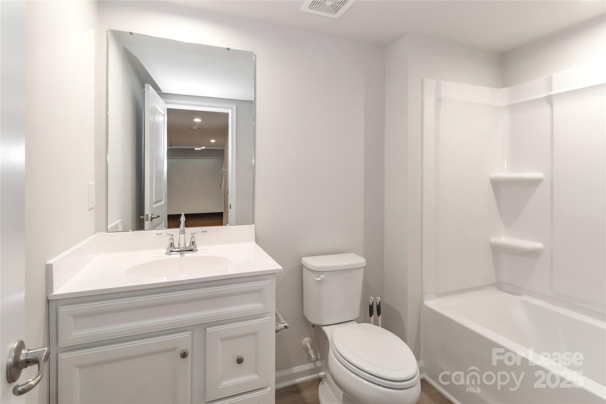 5038 Springarn Court Charlotte, NC 28208 - Photo 34 of 47 a bathroom with a sink a toilet and shower