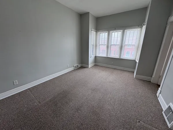 an empty room with a window