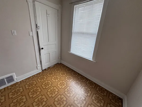 a view of an empty room and window
