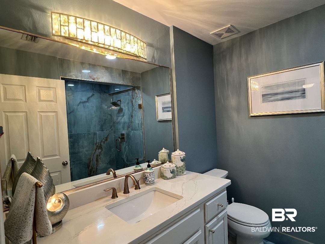 27580 Canal Road, Unit 1210 Orange Beach, AL 36561 - Photo 20 of 28 Full bathroom with vanity and a stall shower