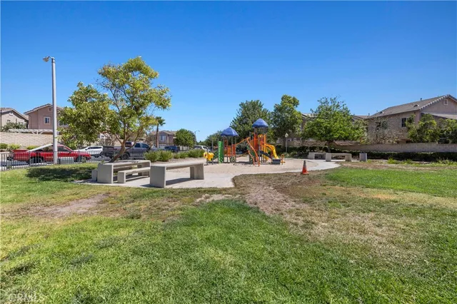a view of a park with swings and slides