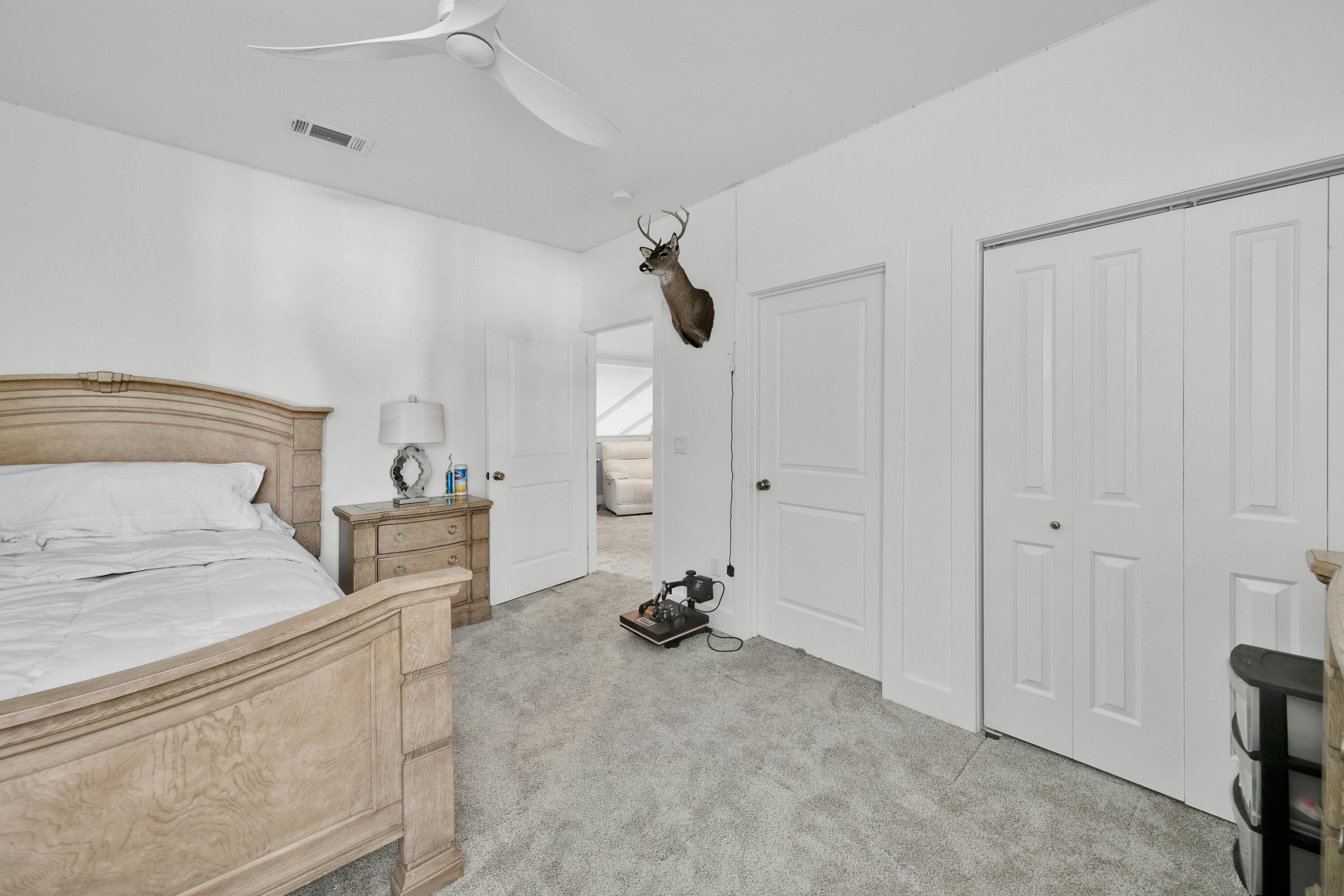 250 Marlberry Trace Santa Rosa Beach, FL 32459 - Photo 24 of 30 a view of a bedroom with a bed and gym equipment