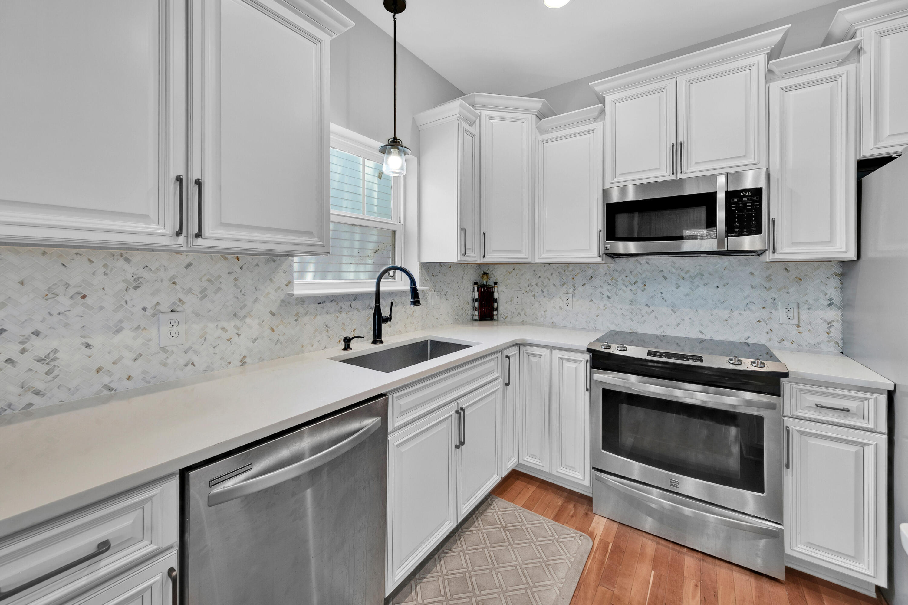 250 Marlberry Trace Santa Rosa Beach, FL 32459 - Photo 10 of 30 a kitchen with stainless steel appliances granite countertop a sink a stove a microwave and cabinets