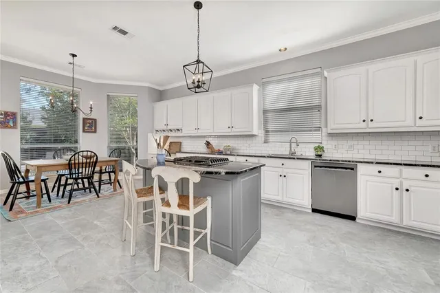 a living room with furniture fireplace and wooden floor