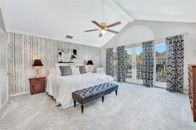a white toilet sitting next to a sink curtain and a shower curtain