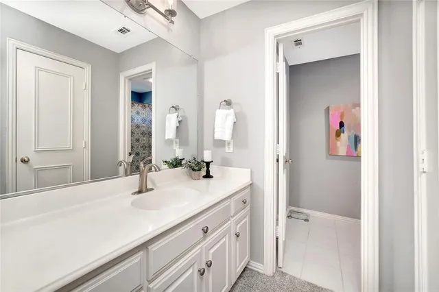 a bedroom with a bed and a cabinets