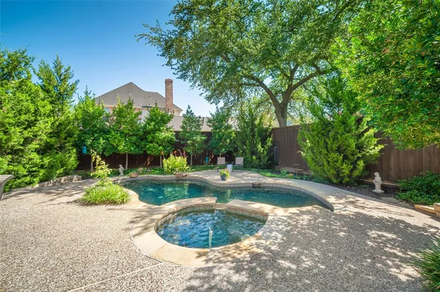 a view of a backyard with sitting area