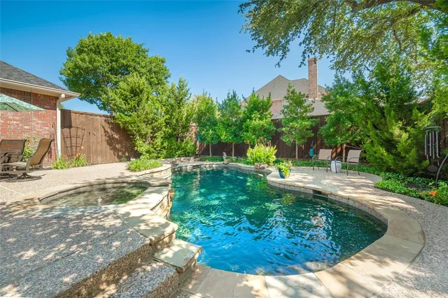 a backyard of a house with yard and outdoor seating
