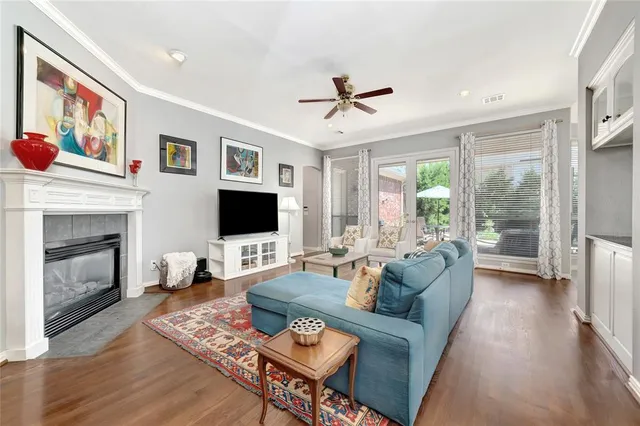 a living room with furniture fireplace and a flat screen tv