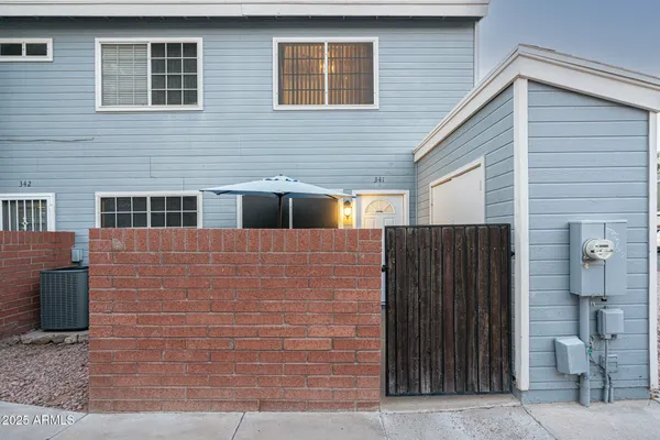 a view of brick house with an outdoor space